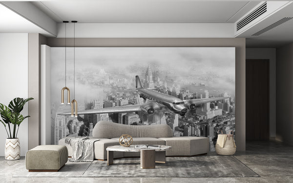 Black & White Wallpaper | Airplane Flying Above The Buildings Mural